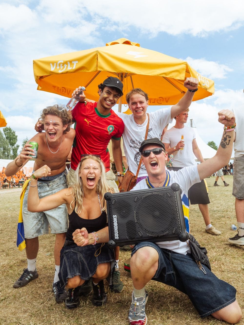 Friends cheering at a festival