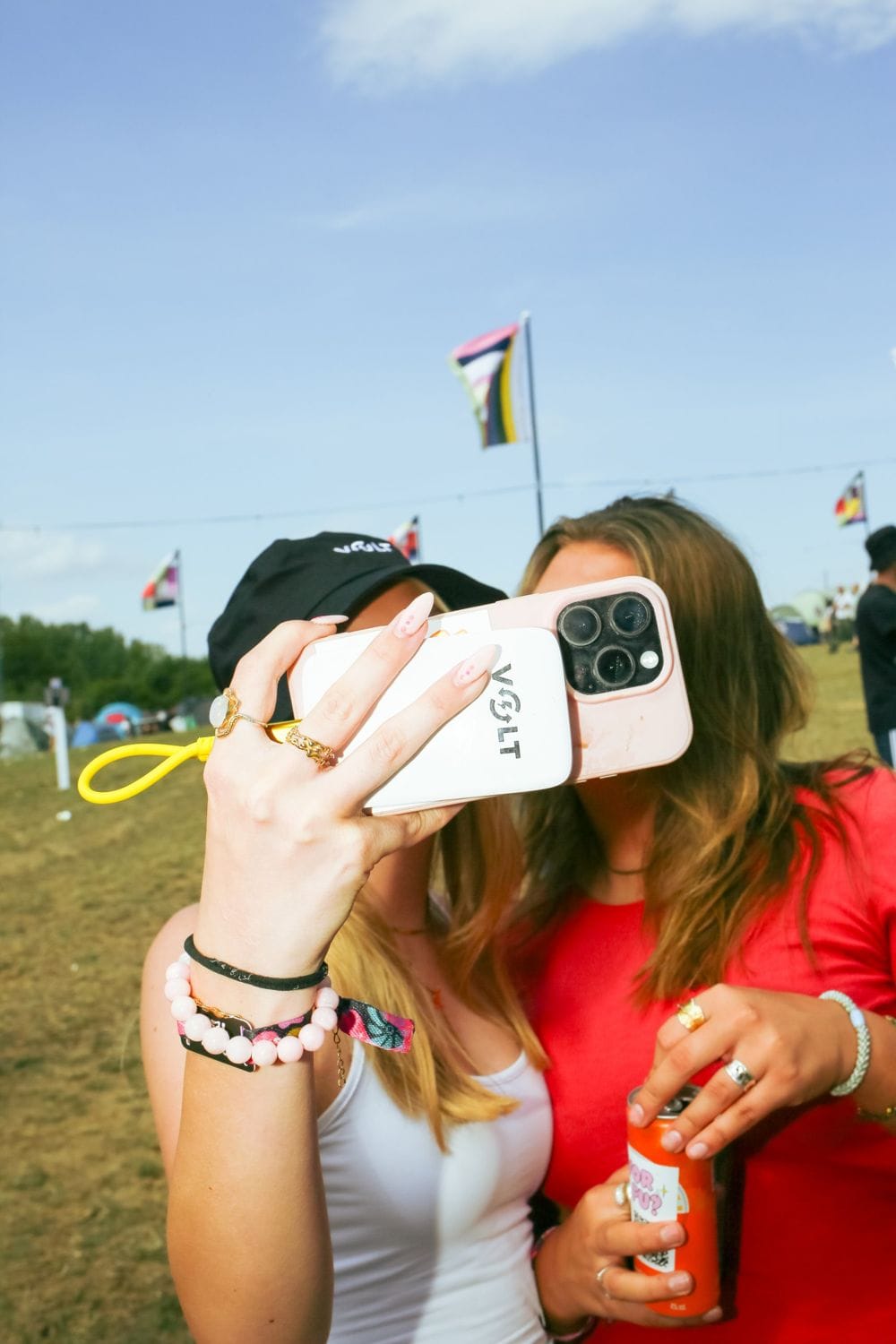 Two friends with a Volt powerbank on a phone